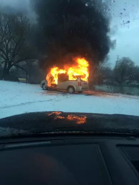 Van fully engulfed in flames