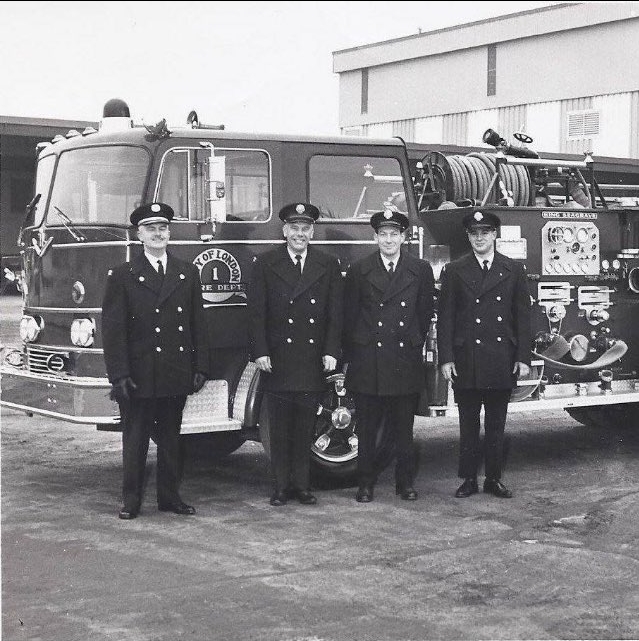 Fire Crew posing in front of their new truck
