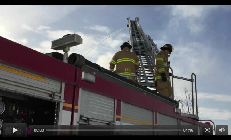 Firefighters on ladder truck