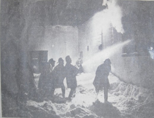 Firemen waded through knee-deep snow to fight a blaze