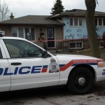 Police car guards the fire scene at 39 Cayuga Cres. Photo By John Miner, The London Free Press