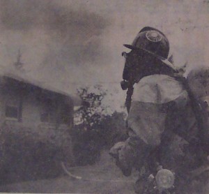  Smoke billows from a Pondview Road home where a London woman lost her life Sunday morning. A firefighter, wearing a mask, prepares to enter the house. Audrey McCallum’s body was found in the bedroom.