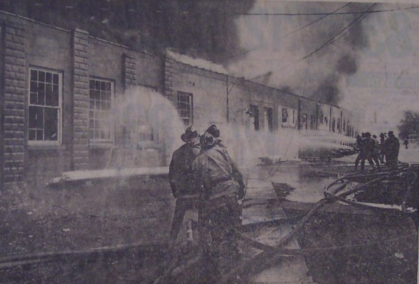  Firemen battle the blaze along the west wall of the White factory. Workers said the fire apparently started in a storage area.