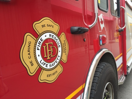 Stock photo of the door of a firetruck displaying the LFD crest