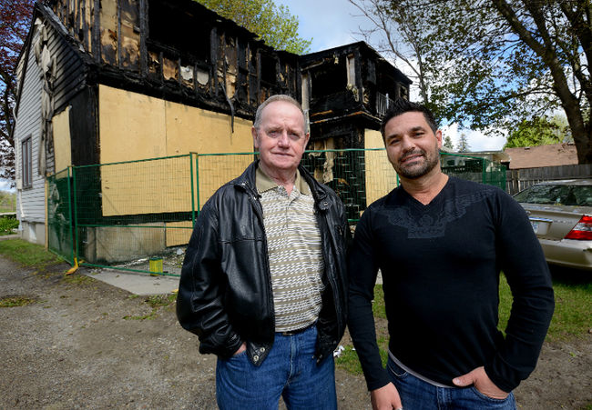 Londoners Doug O’Loughlin, left, and Adam Mortezof stand outside a neighbours home which was destroyed by fire on April 30, 2016. The two men will receive a Citizen Involvement Award from the London Fire Department for their efforts getting family members out of the house during the blaze. (MORRIS LAMONT, The London Free Press)