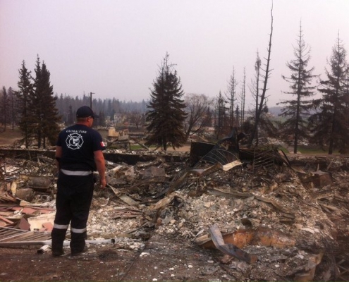 Firefighter Randy Evans surveys the damage in Fort McMurray