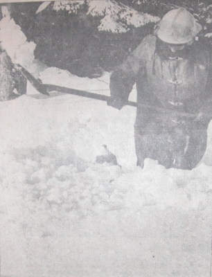 Firefighter Jim Myatt digging out the snow around a fire hydrant