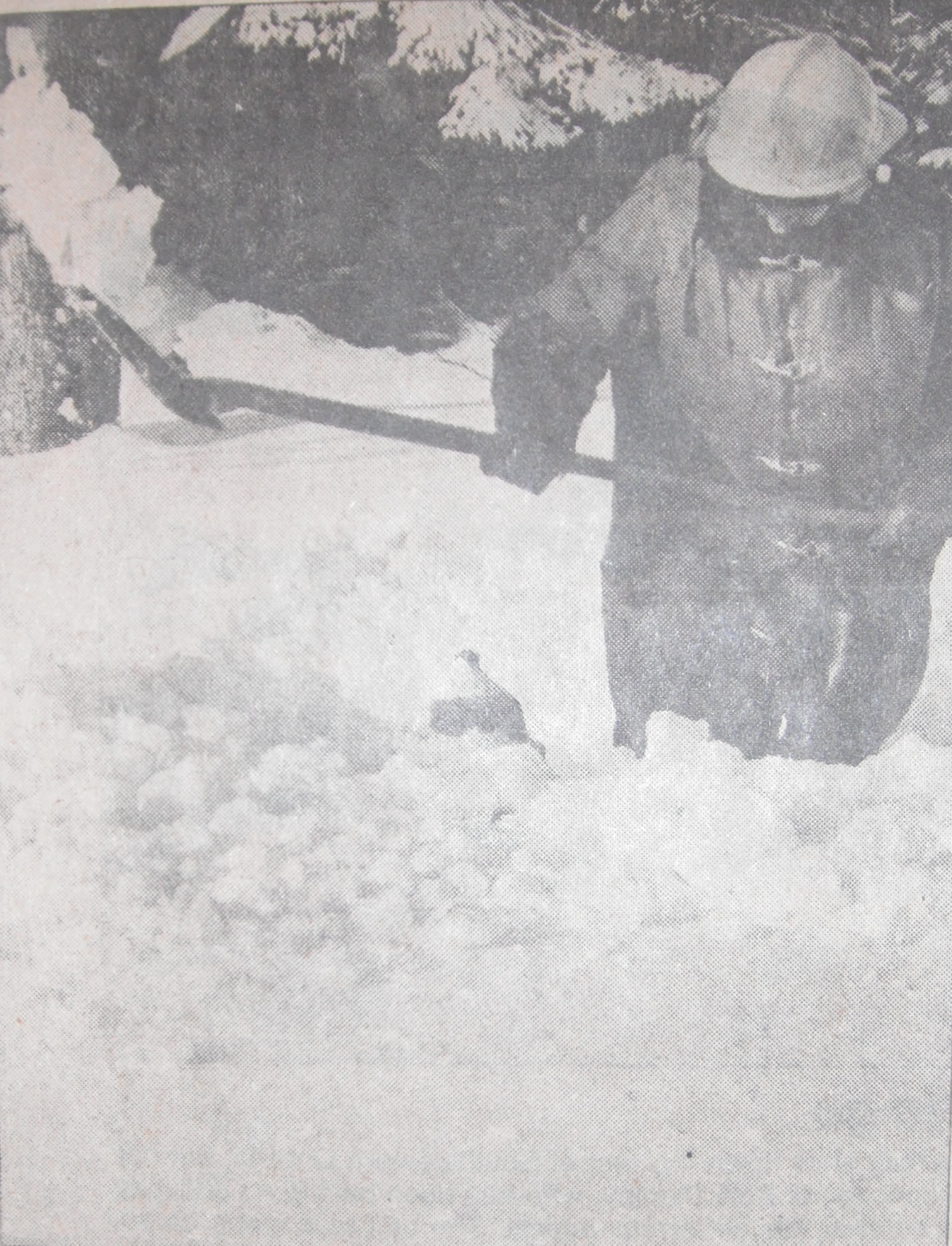 Firefighter Jim Myatt digging out the snow around a fire hydrant 