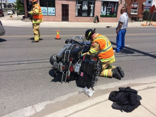 London Fire Fighter examining a motorcycle