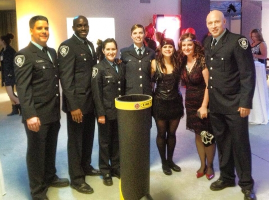 Fire fighters pose while attending the My Sister's Place fundraising event.