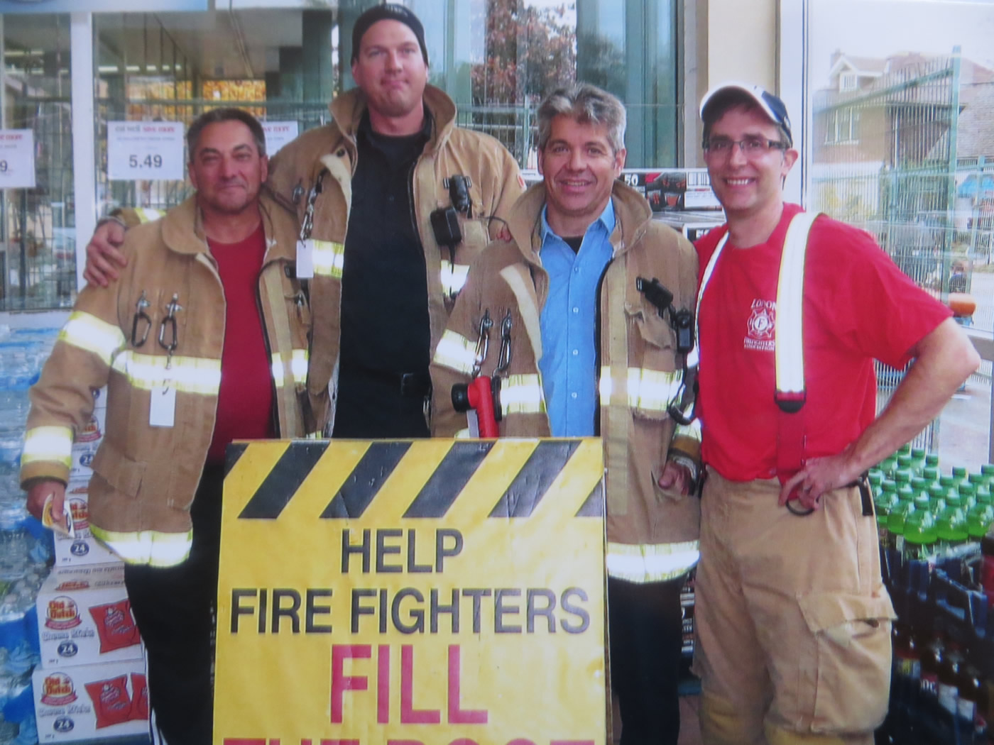Four fire fighters taking a moment to pose for a photo at the annual MD Boot Toll
