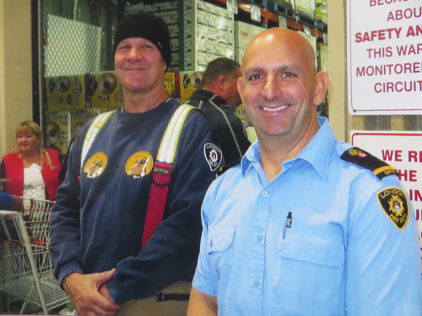 Two fire fighters taking a moment to pose for a photo at the annual MD Boot Toll