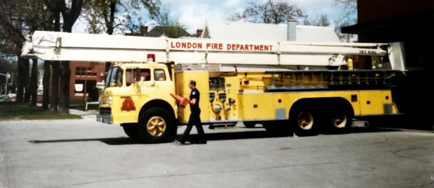 Firefighter walking beside truck one