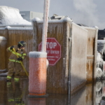Firefighter draining a parking lot from water run off
