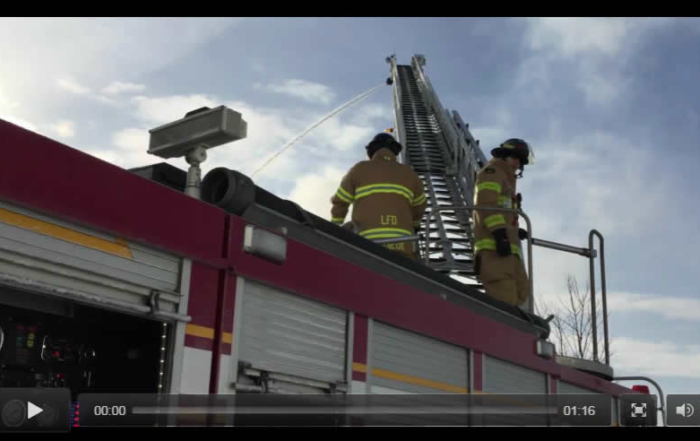 Firefighters on ladder truck