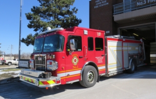 Fire engine number three parked in front of Station 3