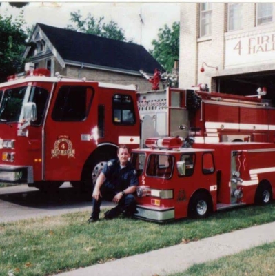 Firefighter Tim Knight posing with Engine