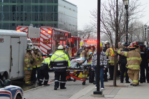 EMS assist patient on stretcher