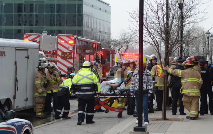 EMS assist patient on stretcher