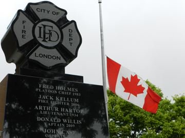 London Fire Fighters Memorial and flag at half staff.