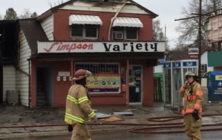 Fire fighters cleaning up from fire