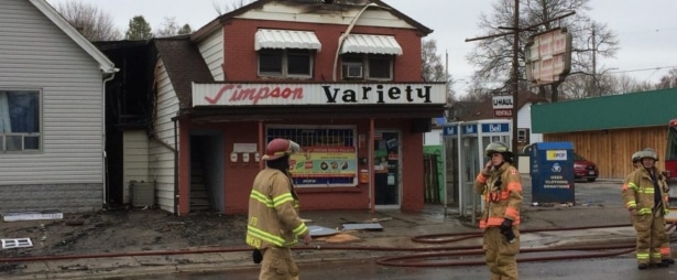 Fire fighters cleaning up from fire