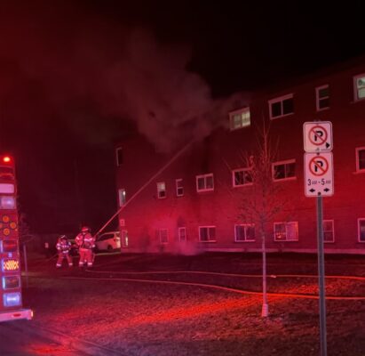 Fire fighters applying water into a third floor window. (Source: Twitter - @LndOntFire)