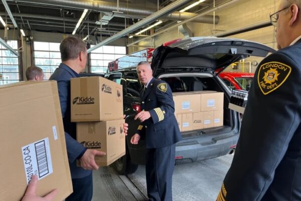 A fresh batch of combination smoke and carbon monoxide are loaded into a vehicle for the Project Home housing stability in London, Ont.