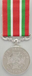 The Ontario medal for firefighting bravery. It is silver in colour hung with a striped ribbin of red, green & white.