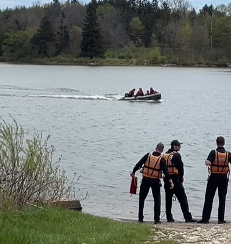 New recruits training in water rescue. Boat landing with crews at the waters edge