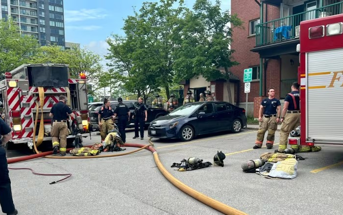 Firefighters cleaning up after a fire