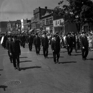 Labour Day in London: Members of the London Fire Department marching east on Dundas Street just west of Waterloo Street during the 1951 Labour Day Parade.