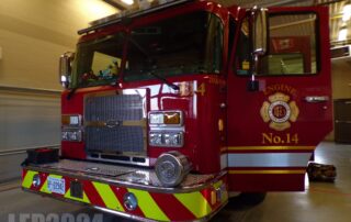 Engine parked inside station 14 with the driver's door open so you can see the logo and engine number