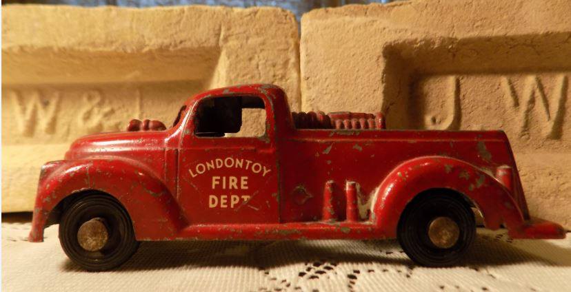 Londontoy Fire Dept truck. This toy was made in London during the 1940's at Websters Mfg located at King and Eleanor streets. Two bricks made in London brickyards are pictured behind the fire truck. Cindy Hartman collection. (Source: Vintage London, Ontario | Facebook)