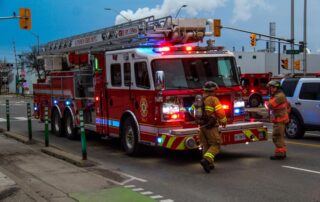 Two London fire fighters working at the front end of Truck 1