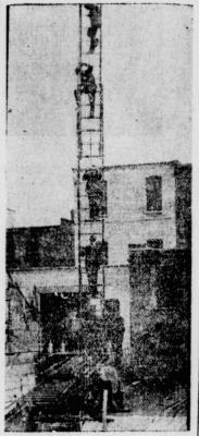 Several London Firemen practising on climbing the 65' ladder