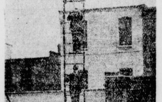 Several London Firemen practising on climbing the 65' ladder