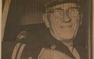 Newspaper clipping with a photo of London Fire Department Platoon Chief Stewart Smith in uniform on his last official rounds.