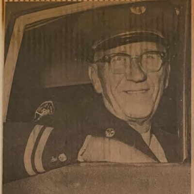 Newspaper clipping with a photo of London Fire Department Platoon Chief Stewart Smith in uniform on his last official rounds.